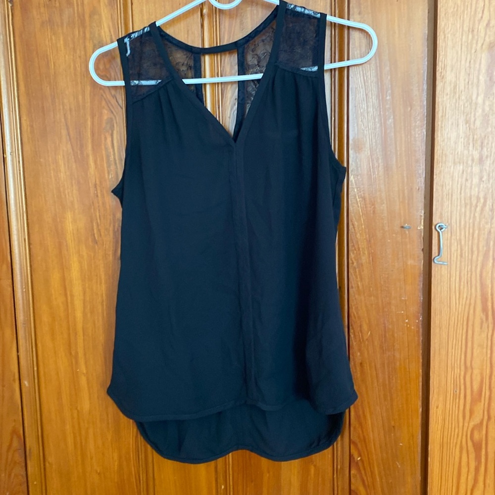 Black sleeveless blouse with lace shoulder detail